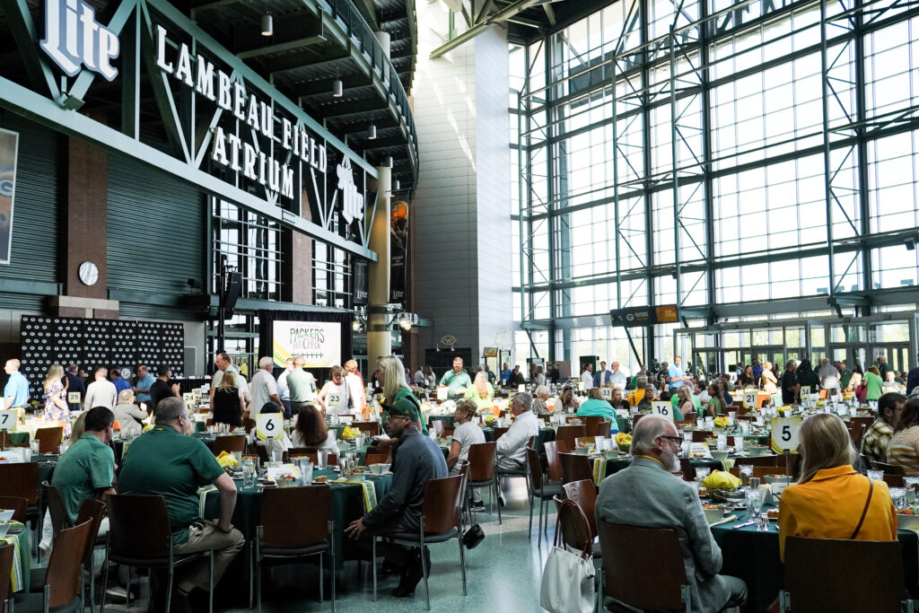 people chatting in a large luncheon