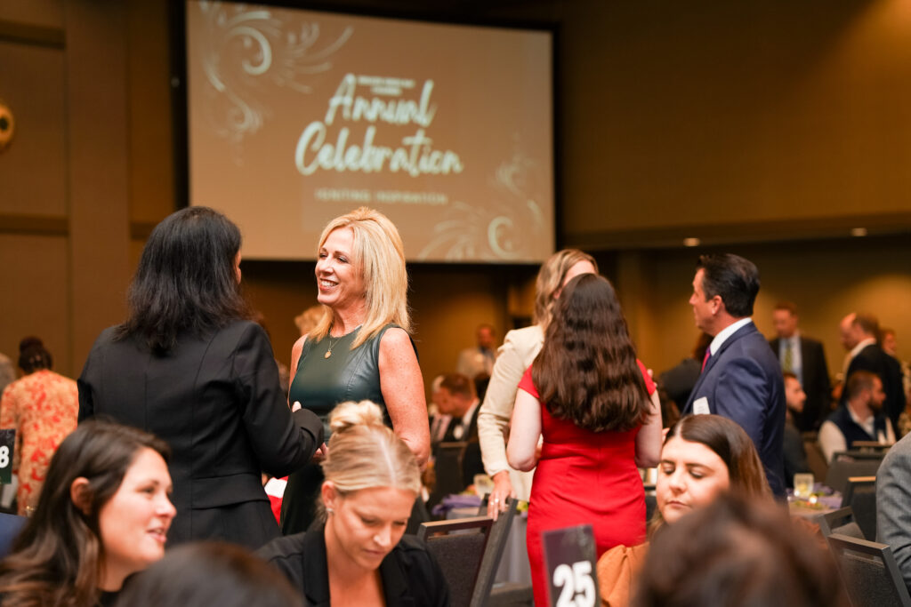group of people networking in an annual celebration event